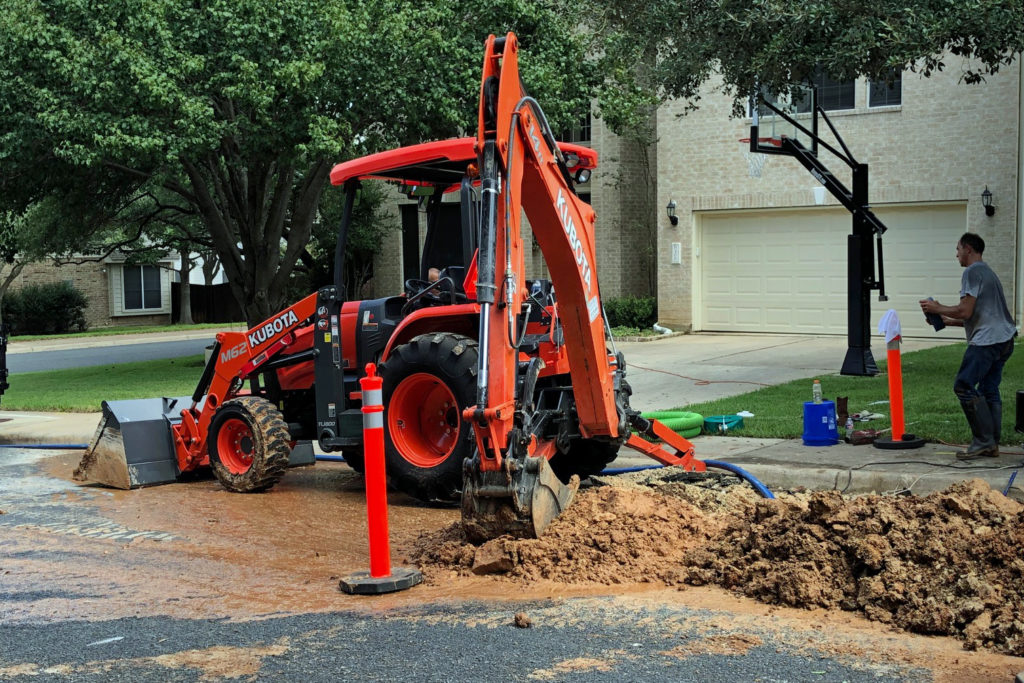 Picture of utility work with backhoe.